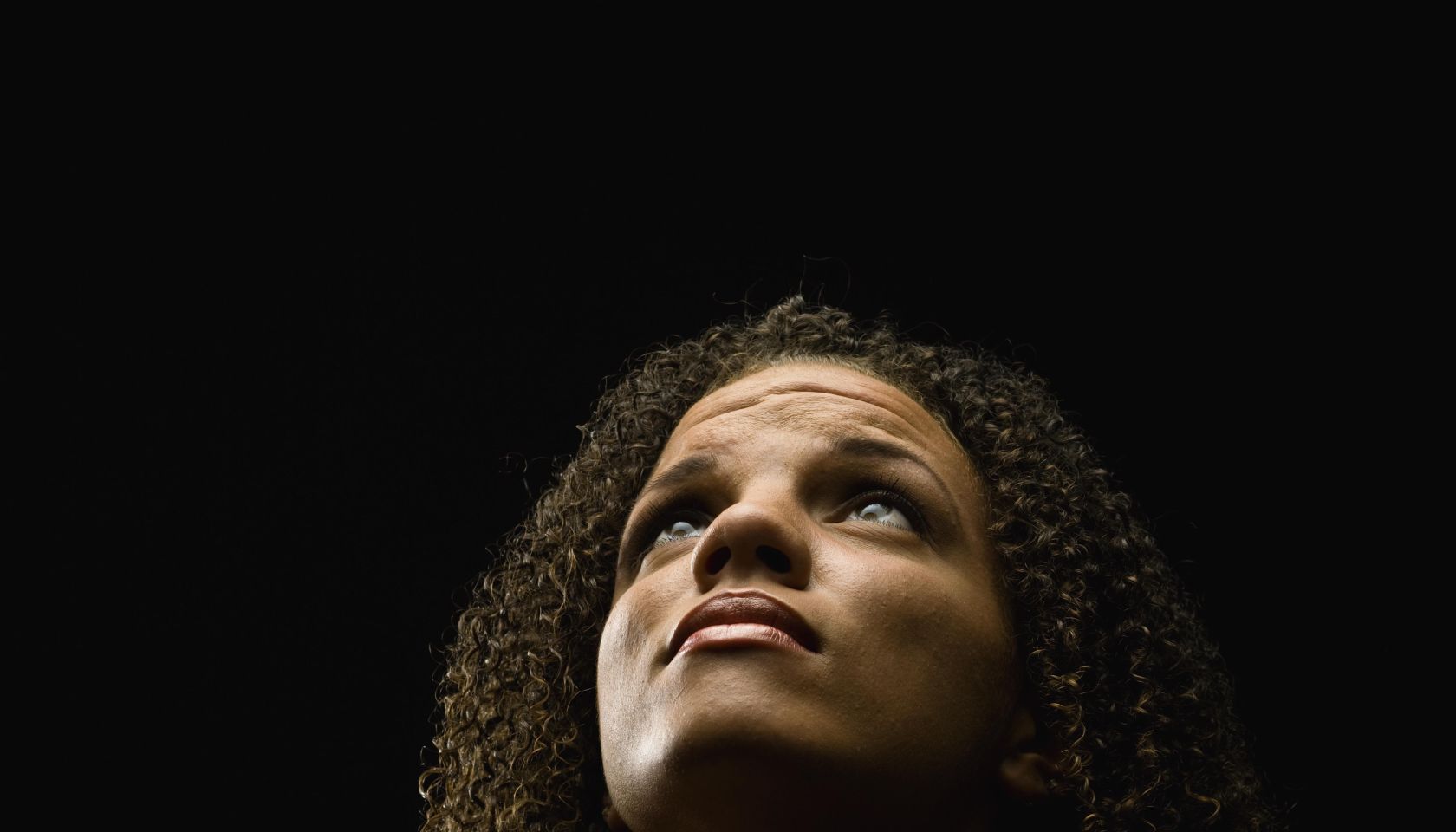 Beautiful young woman praying