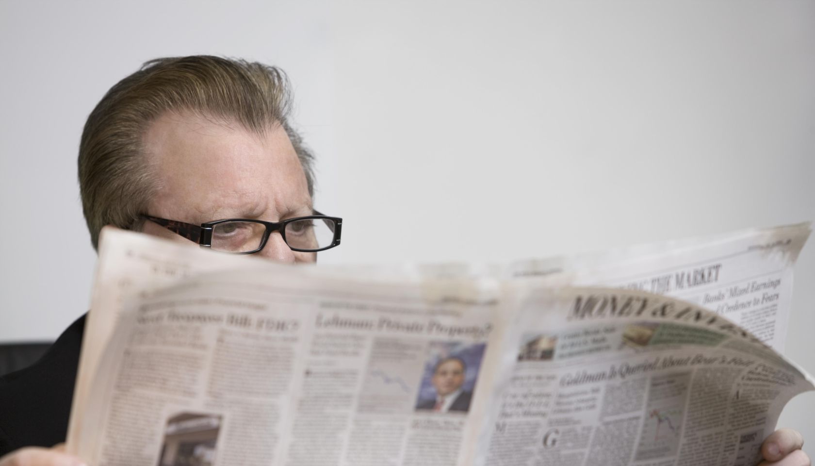 man reading newspaper