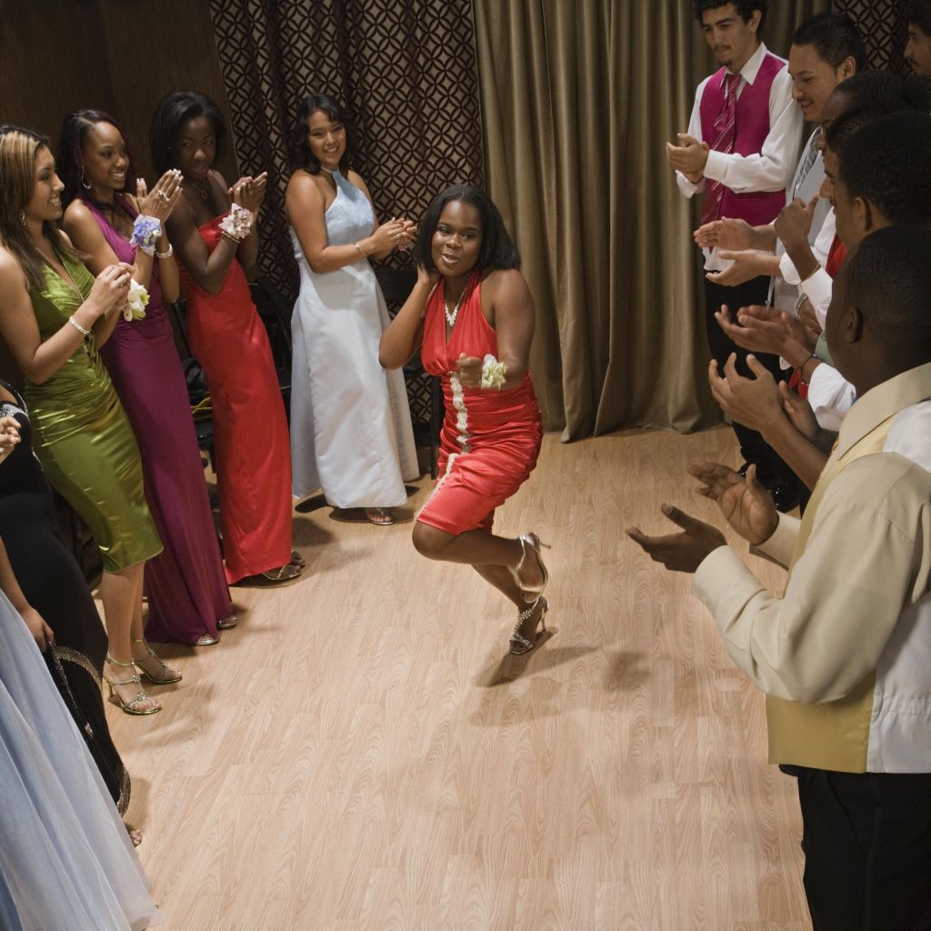 Multi-ethnic teenagers dancing at prom