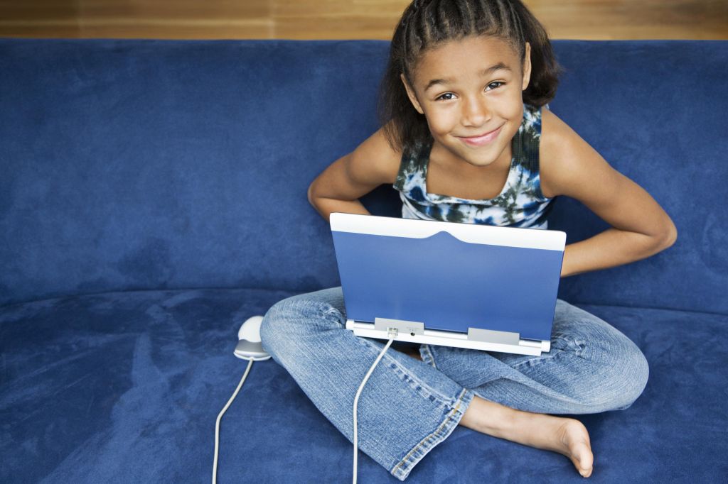 African American girl working on lap top computer