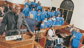 Gospel Choir and Band Playing at a Church Service With a Priest Standing on a Pulpit