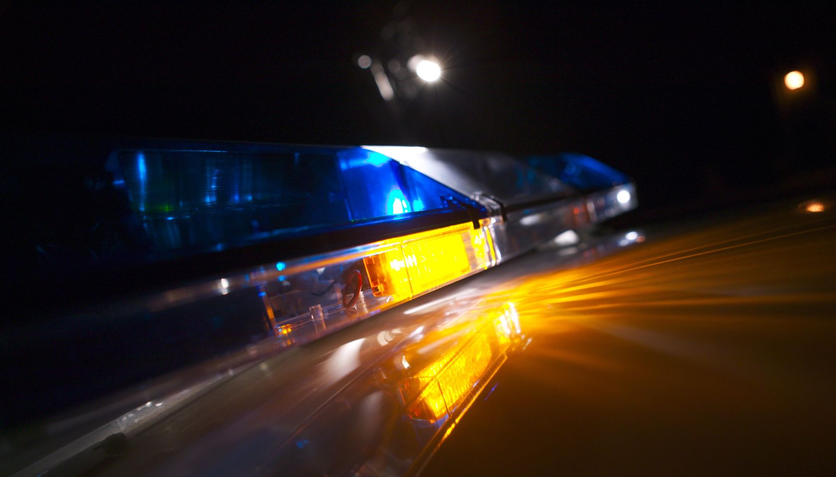 Close-up of a police car's flashing blue lights