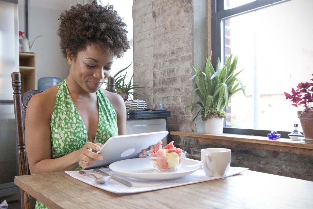 Woman using table computer