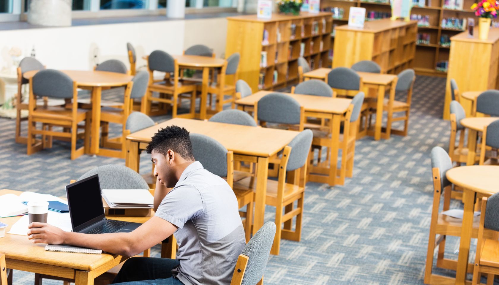 African American high school or college student studying late