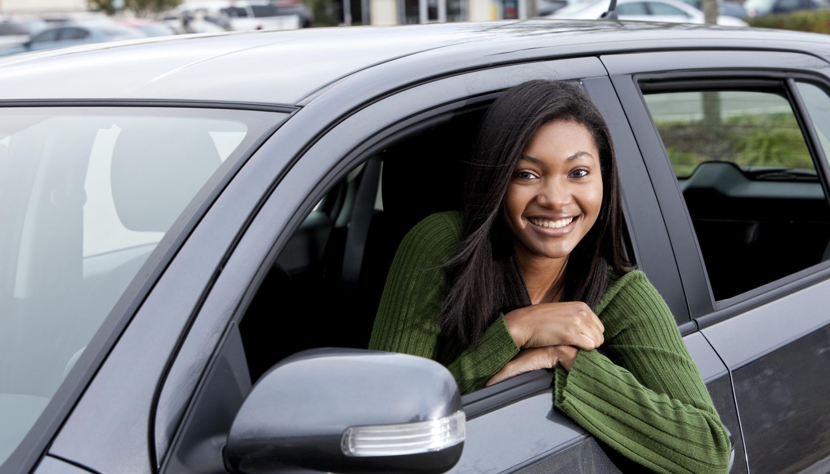 African American teenage girl driving car