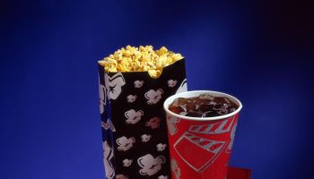 Movie theater hot dog with popcorn and soda