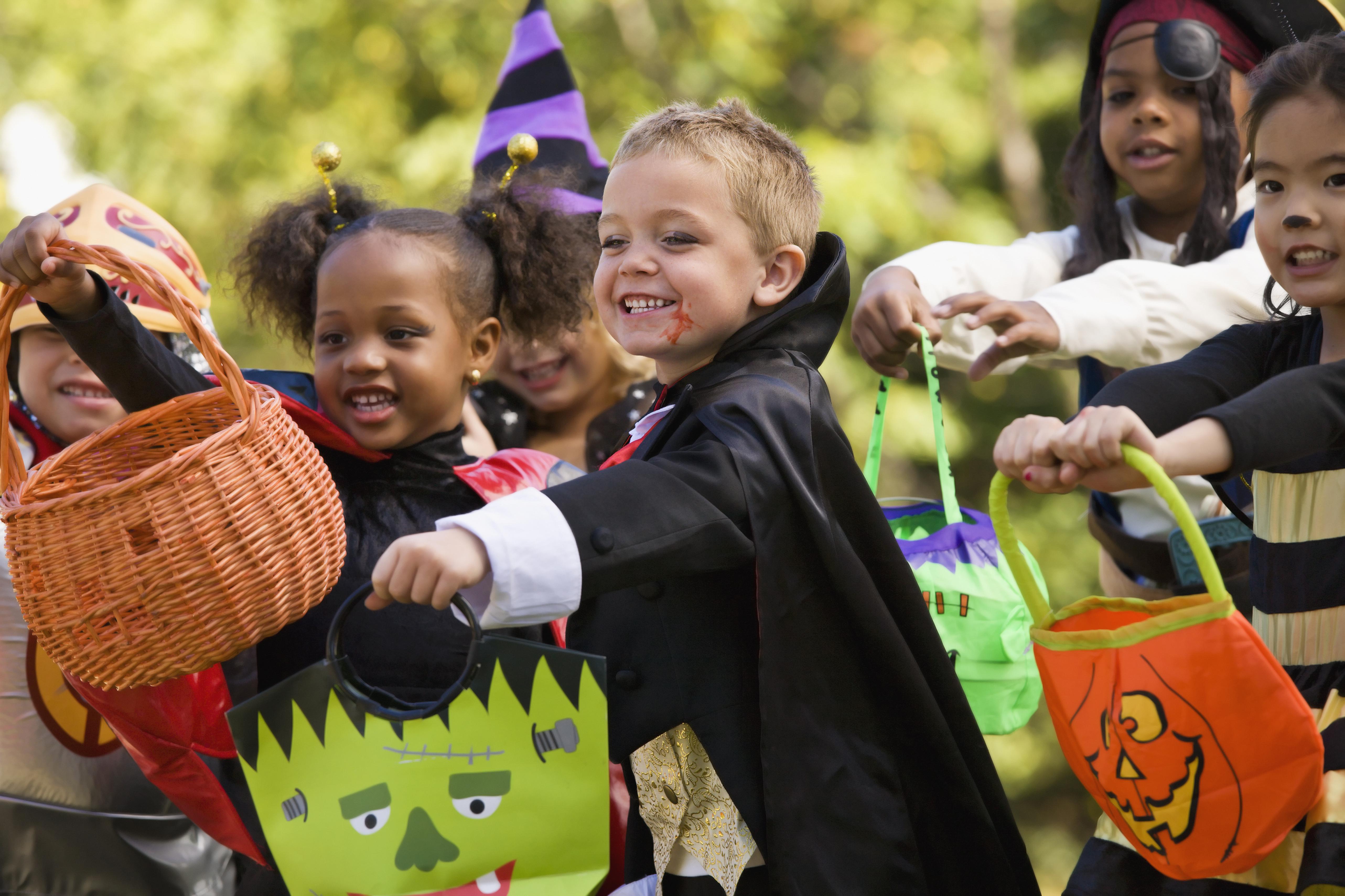 Multi-ethnic children dressed in Halloween costumes