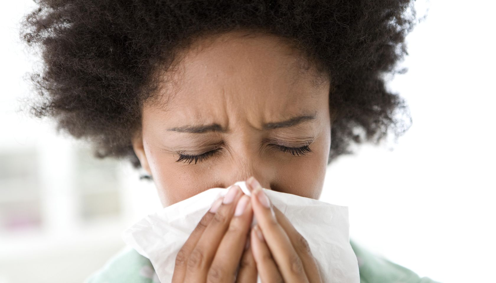 Woman Blowing Her Nose