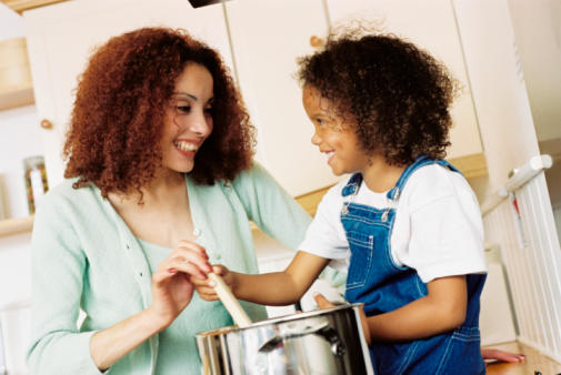 mother cooking with child