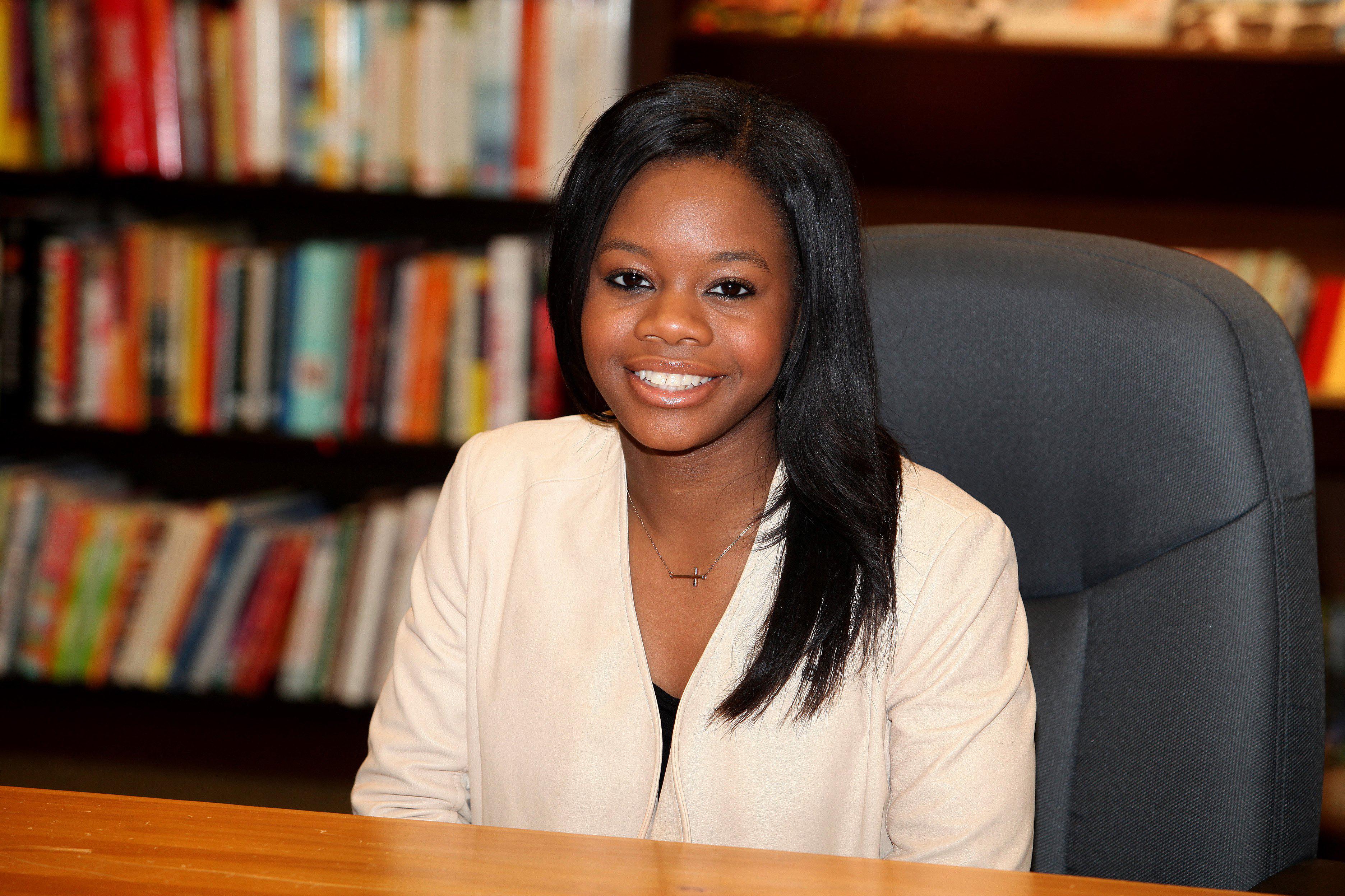 Gabby Douglas Book Signing For 'Raising The Bar' In Skokie, Illinois.