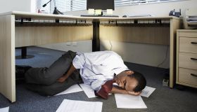 Mid Adult Man Sleeping Near Documents on Floor