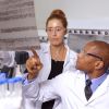 Doctors examining DNA sequencing gel