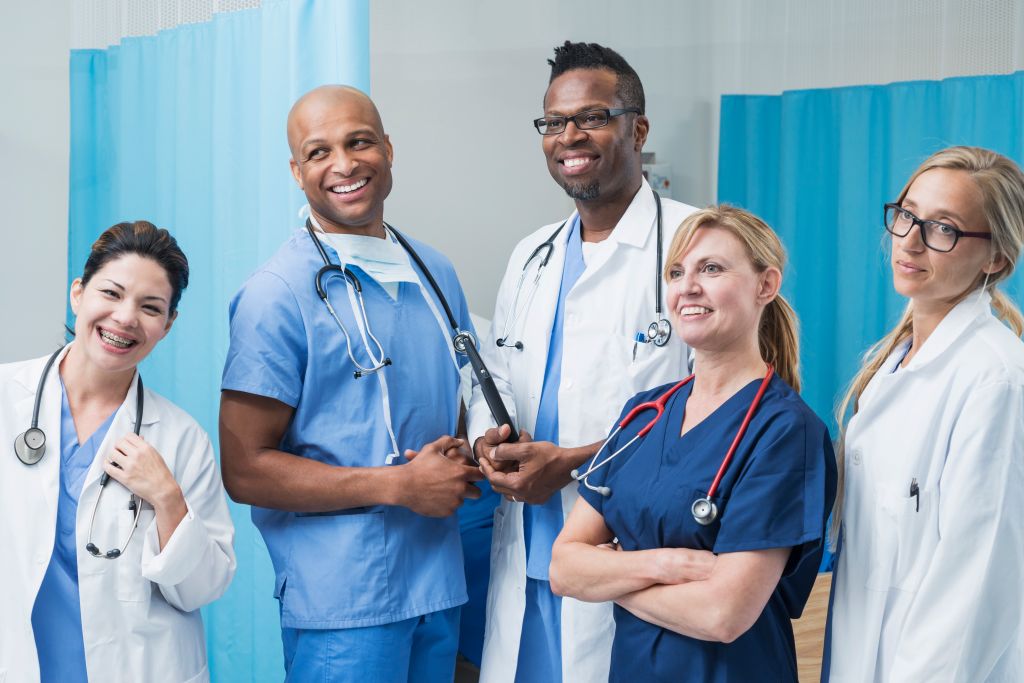 Multiracial group of doctors standing in hospital room