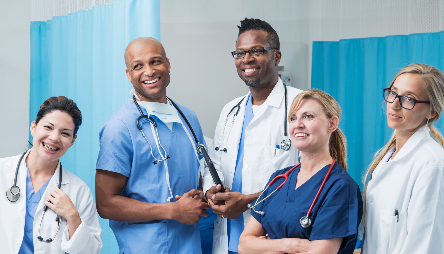 Multiracial group of doctors standing in hospital room