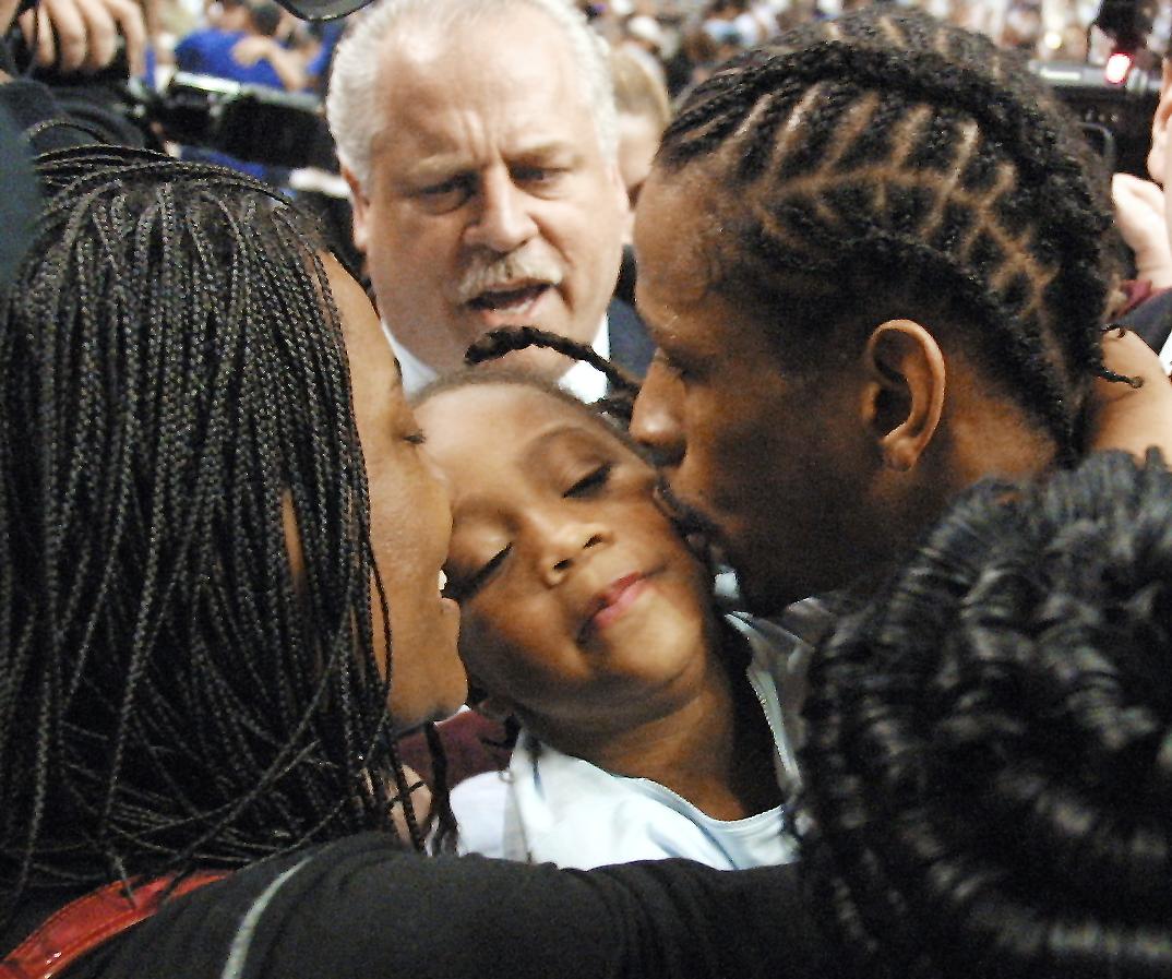 Philadelphia 76ers' Allen Iverson (R) kisses his d