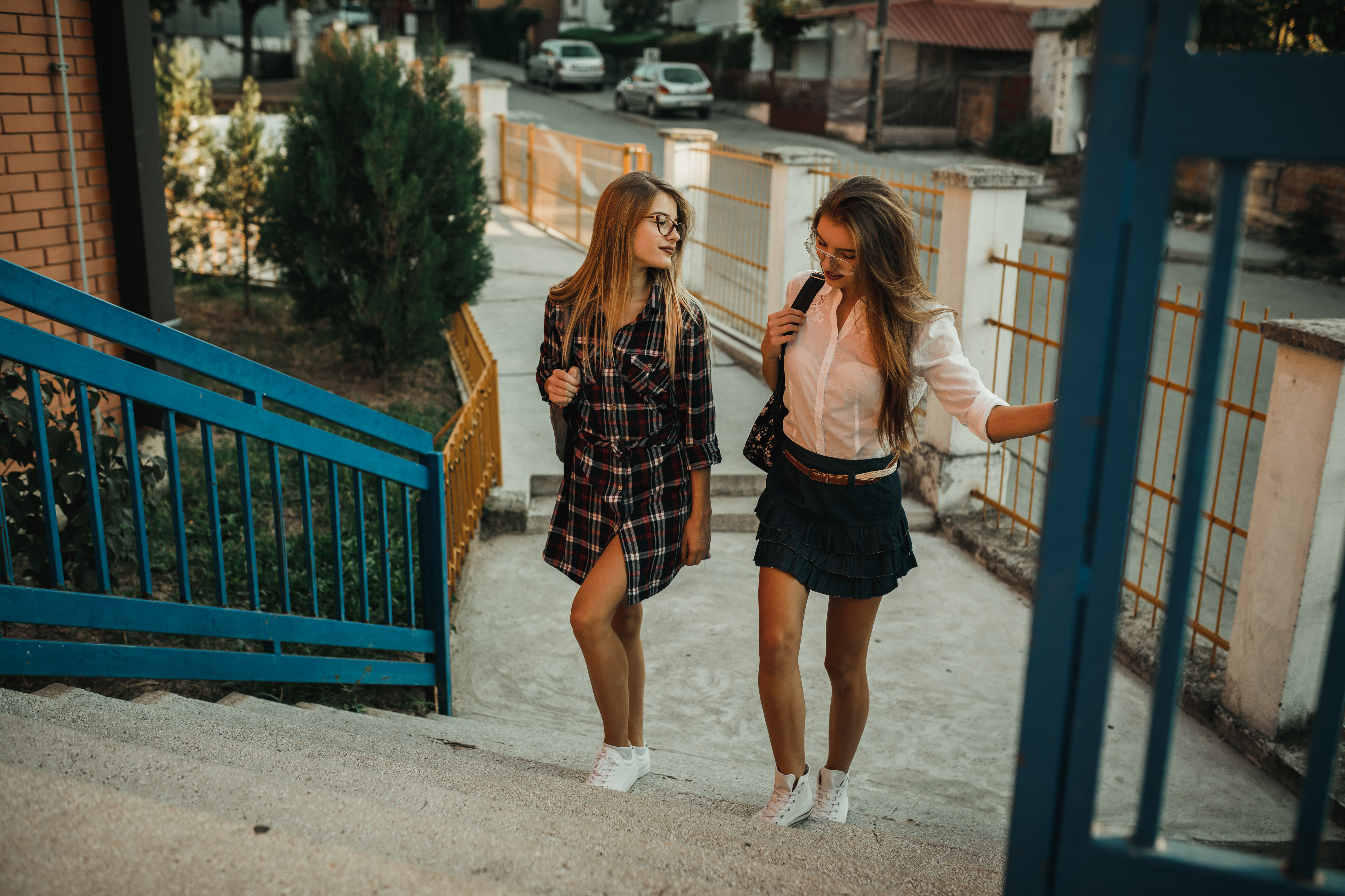 Beautiful teenage girls in front of a school building