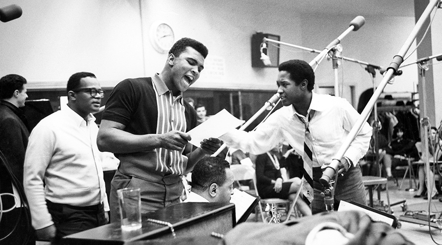 Sam Cooke (right), who was very active in the civil rights movement before his death, is pictured here with Muhammad Ali (center) [Credit: Getty]