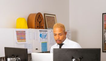 African American Man Staring At Computer