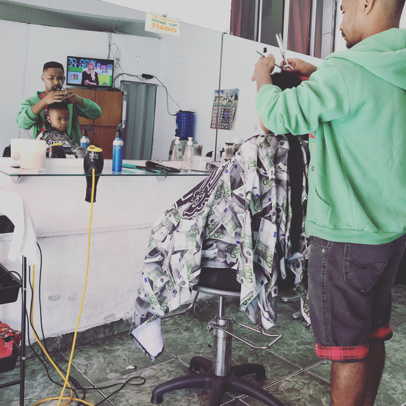 Barber Cutting Boy Hair In Salon