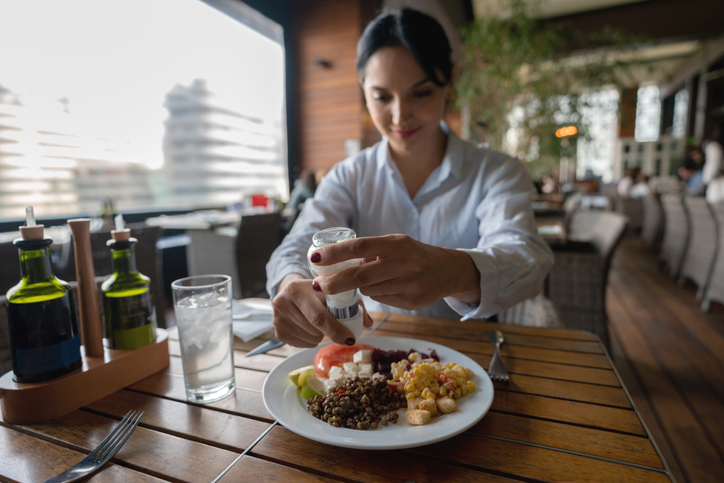 Latin american woman enjoying a healthy meal at the hotel restaurant