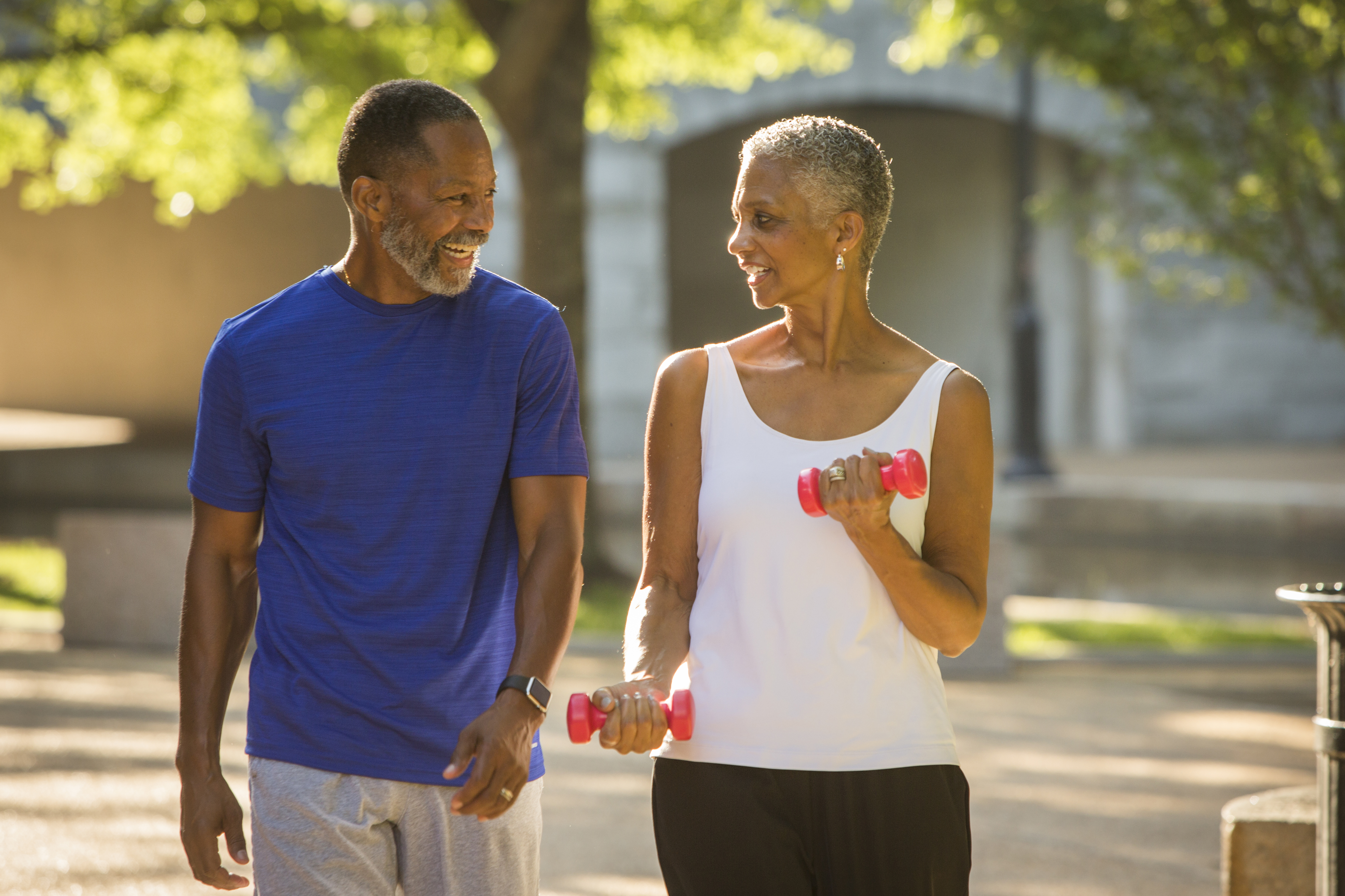 Black couple walking in park