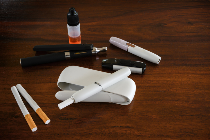 High Angle View Of Electronic Cigarettes On Table