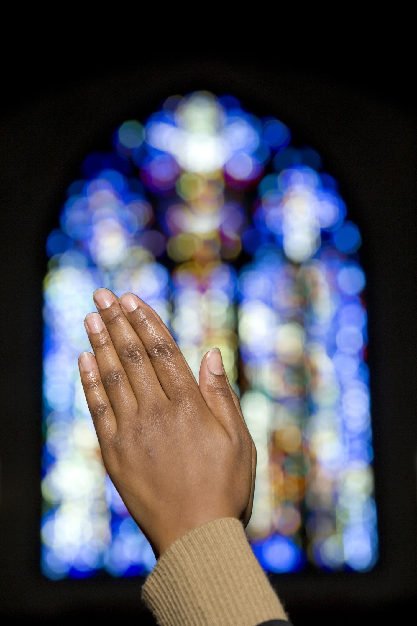 African lady praying in church