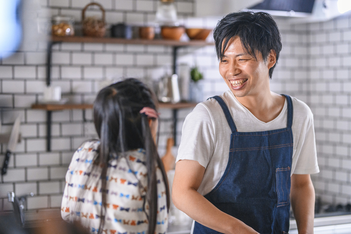 Japanese Father and Young Daughter Bonding in Kitchen