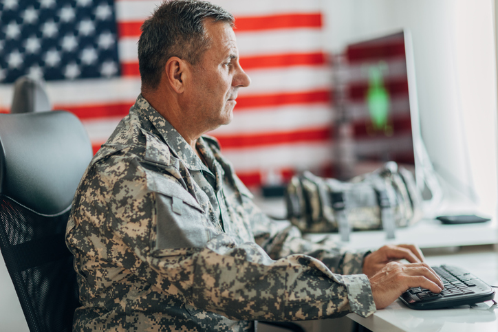 Army soldier using computer