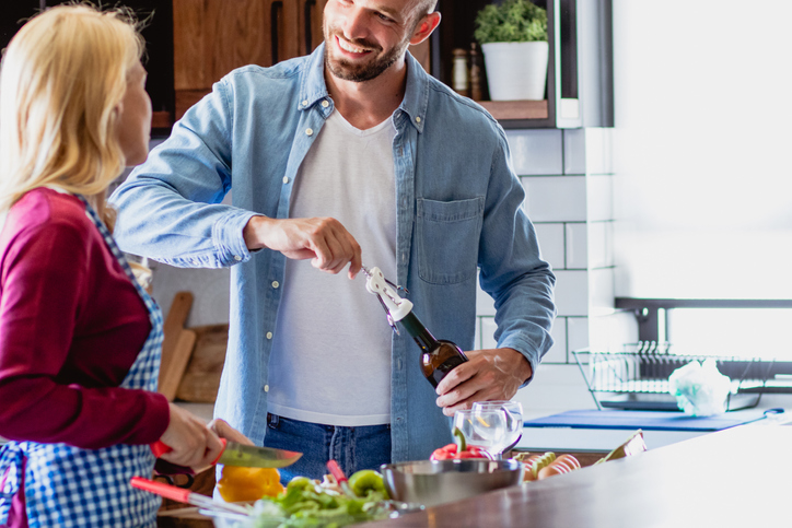 Young couple is preparing lunch in the kitchen