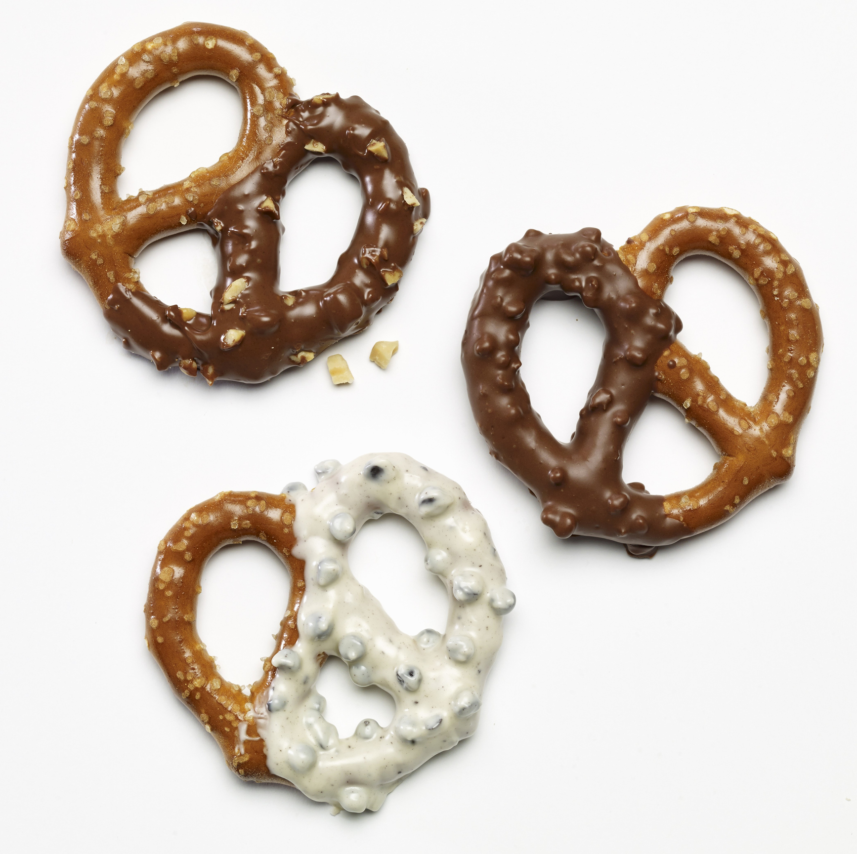Three pretzels dipped in white and dark chocolate