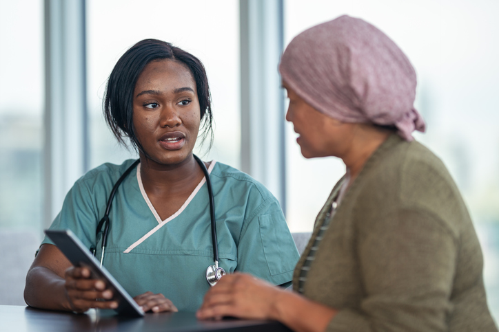 Female doctor consults patient with cancer