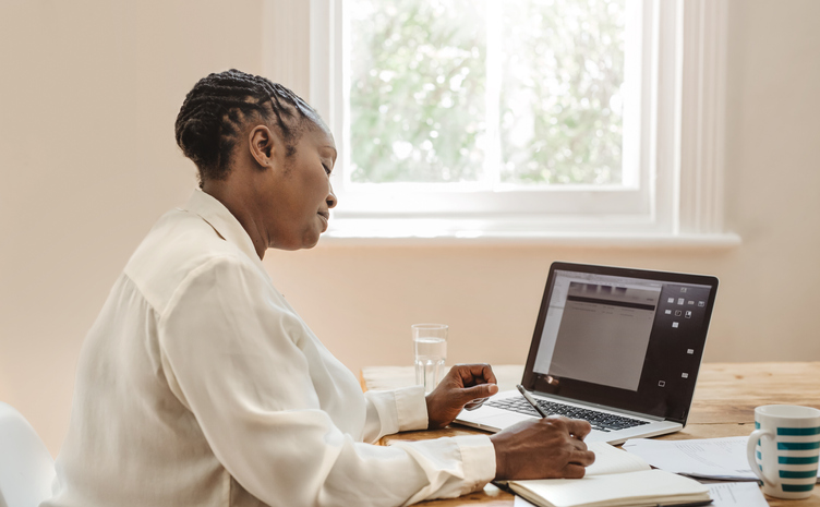 Mature African American female entrepreneur working from her home office