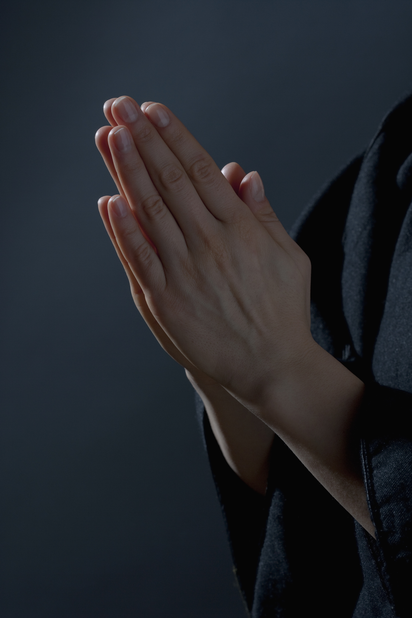 Detail of a woman praying