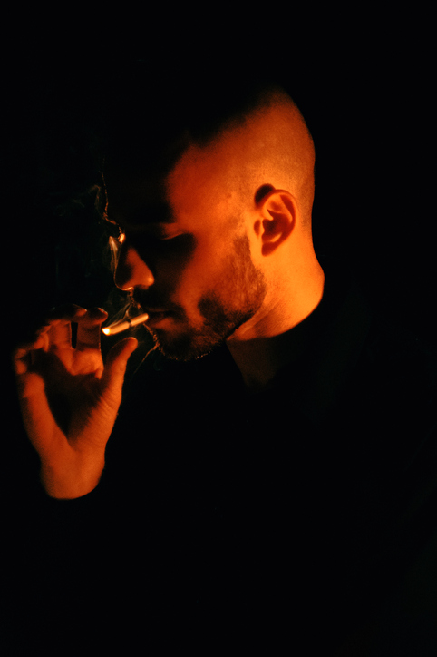 Man Smoking In Neon
