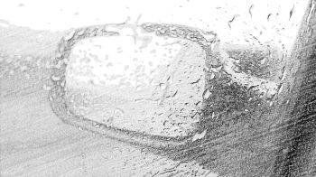 View of a car wing mirror during rain