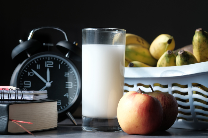 milk, apple, banana ad clock