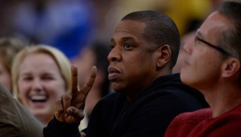 Rapper Jay-Z gestures while sitting court side as the Golden State Warriors play the San Antonio Spurs in the second quarter of their game at Oracle Arena in Oakland, Calif., on Monday, Jan. 25, 2016. (Jose Carlos Fajardo/Bay Area News Group)
