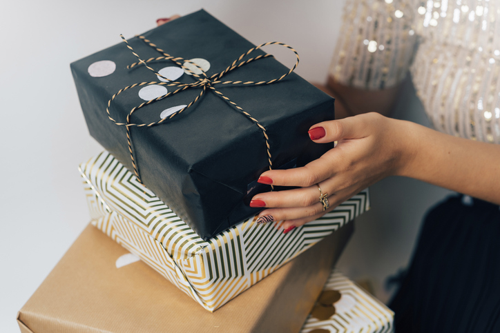 Young woman holding presents