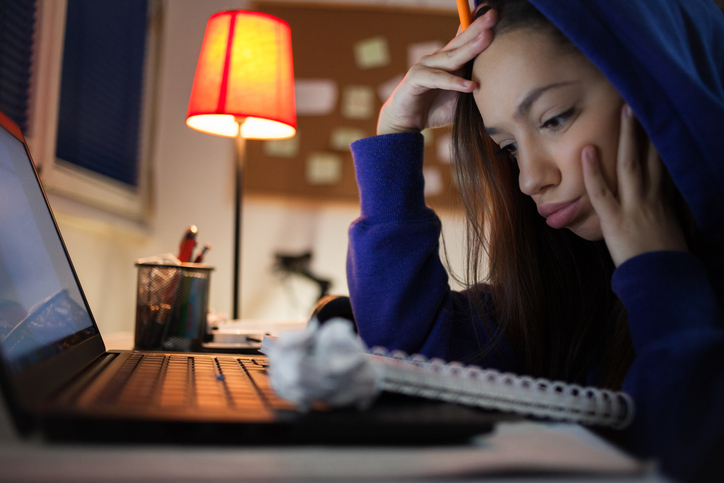 Young girl studying at home