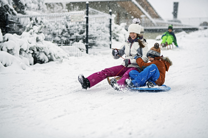 Children sledding in winter.