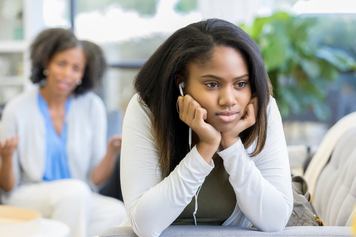 Rude teenage girl ignores her mom