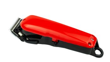 Close-Up Of Red Hair Clipper Over White Background