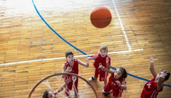 Female School Basketball Team Playing Game