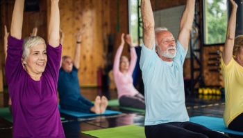 Group of seniors staying active with yoga