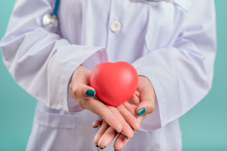 Doctor hands holding red heart, love and health medical and insurance concept