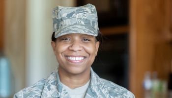 Adult woman wearing military uniform
