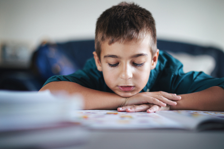 Cute boy doing his homework