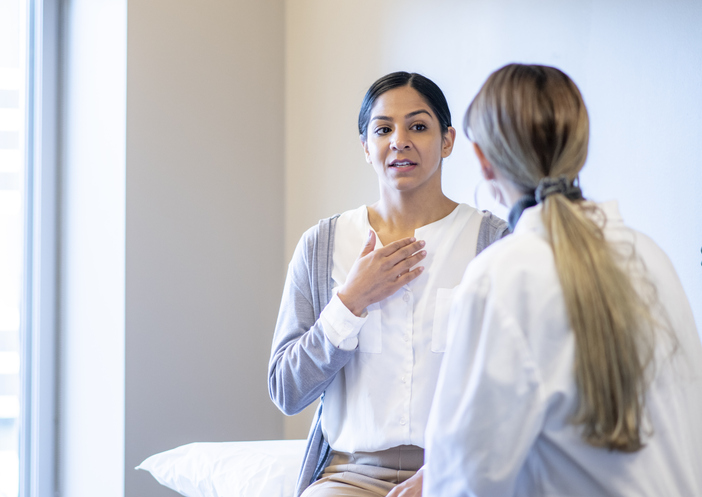 Woman With a Sore Throat at the Doctors stock photo