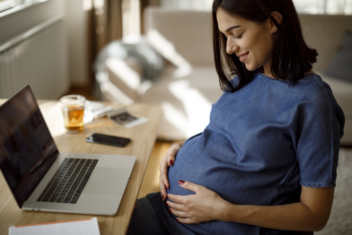 Happy pregnant woman at home